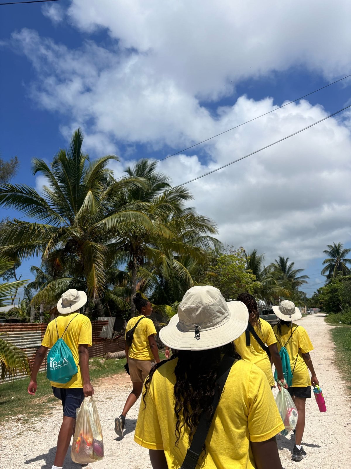 Service trip participants walking in Belize